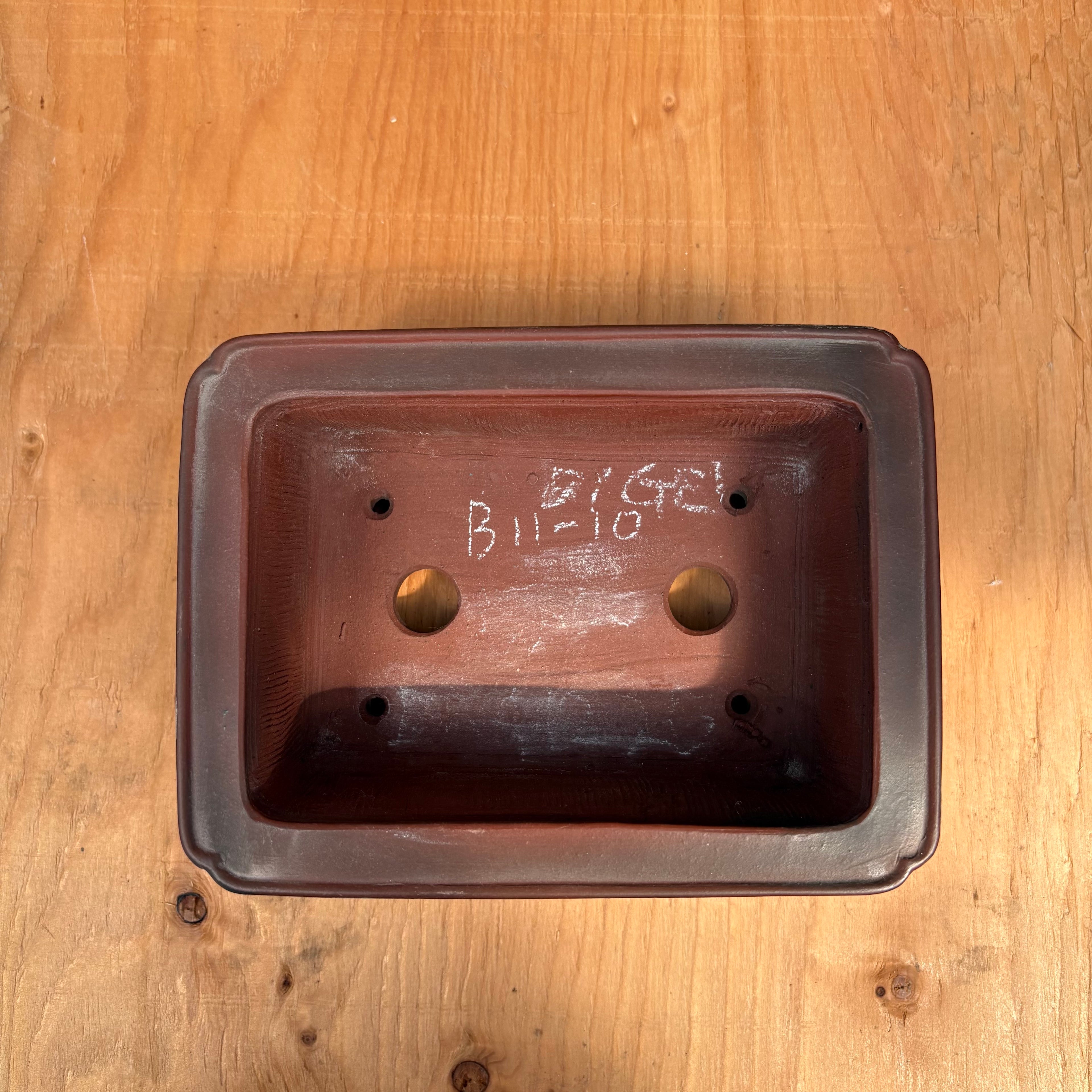 Two drainage holes, four wire holes.