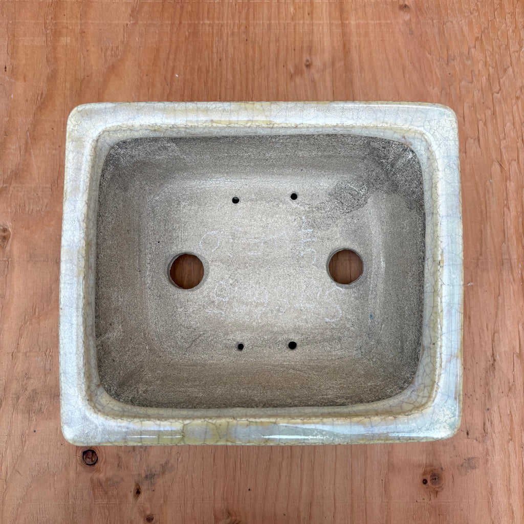 Top view showing 2 drainage holes and 4 wire holes.