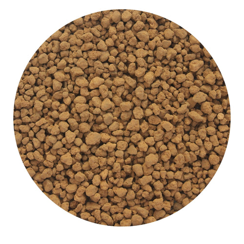 Close-up of dry, light-brown Akadama clay particles showing the porous surface of this volcanic bonsai aggregate.